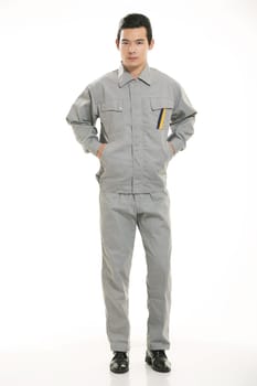 The young engineer various occupation clothing standing in front of a white background