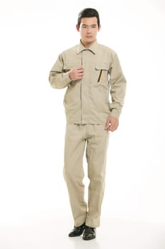 The young engineer various occupation clothing standing in front of a white background