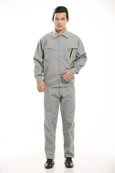 The young engineer various occupation clothing standing in front of a white background