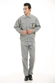The young engineer various occupation clothing standing in front of a white background