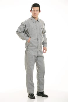 The young engineer various occupation clothing standing in front of a white background
