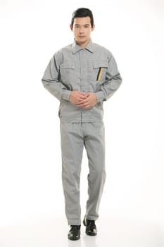 The young engineer various occupation clothing standing in front of a white background