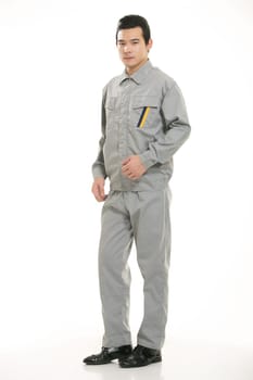 The young engineer various occupation clothing standing in front of a white background