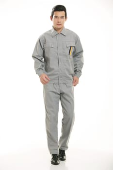 The young engineer various occupation clothing standing in front of a white background
