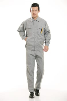The young engineer various occupation clothing standing in front of a white background