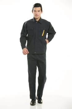 The young engineer various occupation clothing standing in front of a white background