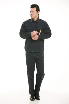 The young engineer various occupation clothing standing in front of a white background