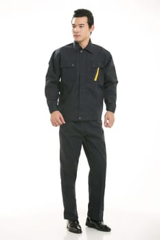 The young engineer various occupation clothing standing in front of a white background