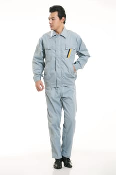 The young engineer various occupation clothing standing in front of a white background