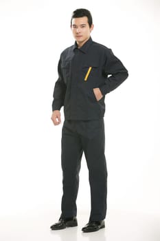 The young engineer various occupation clothing standing in front of a white background
