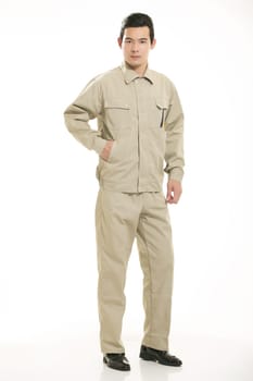 The young engineer various occupation clothing standing in front of a white background