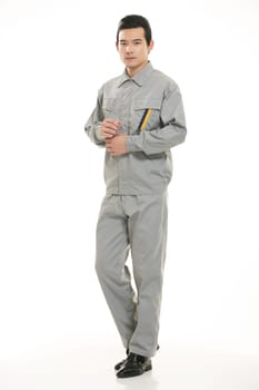 The young engineer various occupation clothing standing in front of a white background