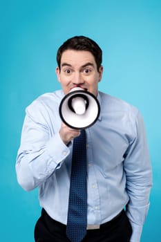 Middle aged businessman talking on a megaphone