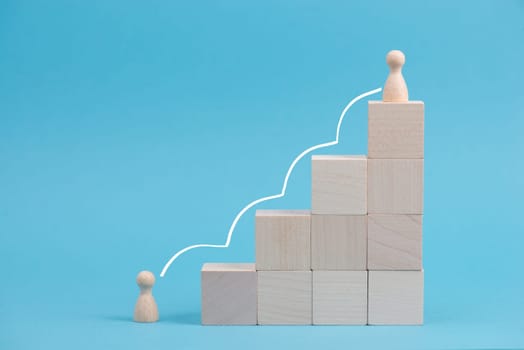 Wooden cubes building stairs, one person is standing at the bottom and the other men is standing on top, different positions