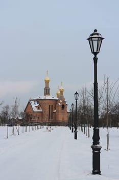 snowy road to the temple winter landscape foreground lamp post