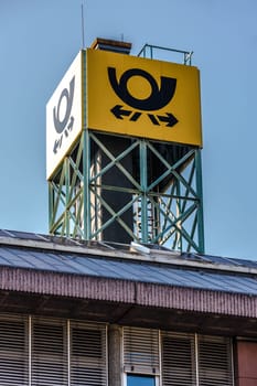 GIESSEN, GERMANY - 2021_04_09: the logo of the brand "Deutsche Post"" at a delivery point in Giessen. Deutsche Post DHL is the world's largest courier company."