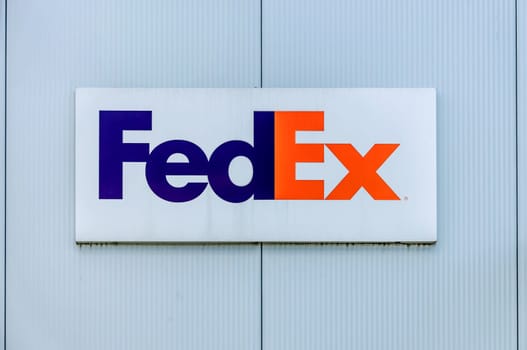 GIESSEN, GERMANY - 2021_04_09: A sign Fed Ex Logo on a Facade in GIESSEN.