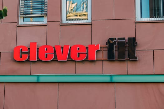GIESSEN, GERMANY - 2021_04_09: CLEVER FIT Sign above the entrance showing a clever fitness discount gym.