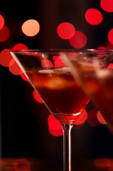 Red cocktail in martini glasses