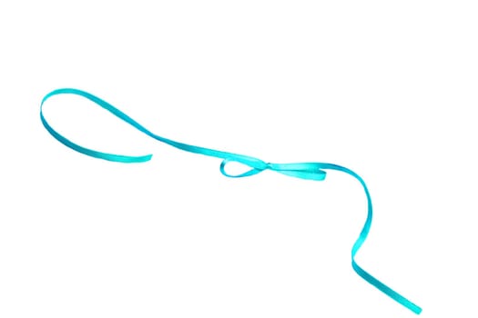 Gift bows. Closeup of a decorative blue turquoise ribbon bow made of silk for gift box isolated on a white background. Decorations background. Macro photograph.