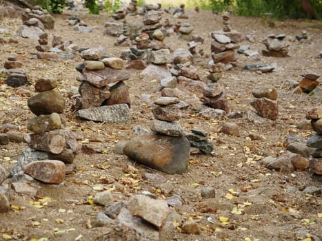 rock garden, many small stone pyramids, a place of ancient pagan rituals