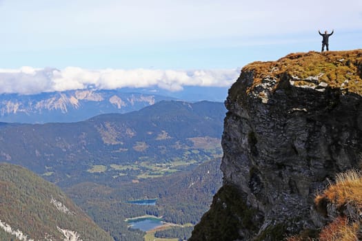 A man stands at the Lahnscharte near the Mangartstrae in Slovenia