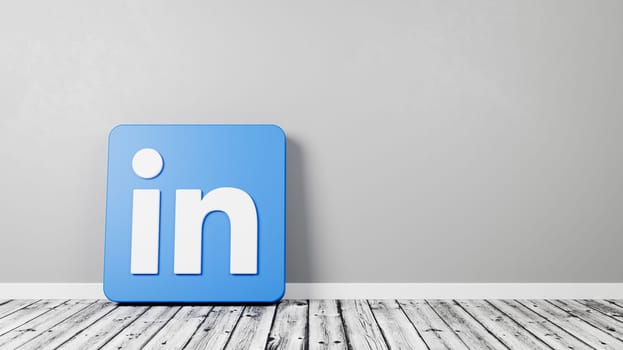 Linkedin Logo 3D Symbol Shape on Wooden Floor Against Gray Wall with Copy Space 3D Render Illustration