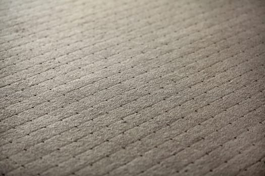 Abstract background - shallow depth of field photo - carpet with square texture.