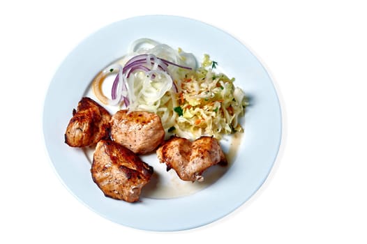 shish kebab with salad on a white plate on a white background. High quality photo