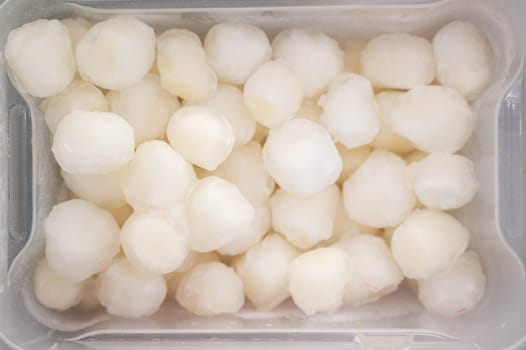 Frozen scallop in fridge at the fish market. Healthy eating and fish market concept