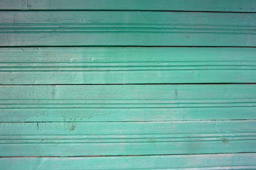 part of the wall is made of boards clapboard painted in green. High quality photo