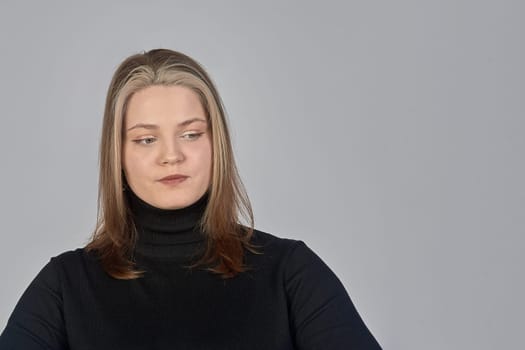 Pensive woman in the background, space for text. Thinks about the answer to the question. High quality photo