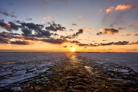 Sunset over the river in the ice. High quality photo