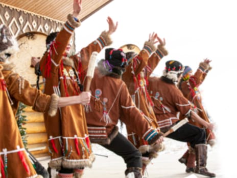 The blurred image folk ensemble performance in dress of indigenous people of Kamchatka.
