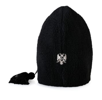 The Traditional fur military ethnic hat with Serbian coat of arms isolated
