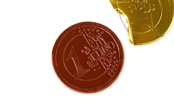 The opened Chocolate candy in the form of 1 euro isolated on white