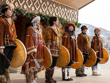 KAMCHATKA, RUSSIA - DECEMBER 24, 2021: Folk ensemble performance in dress of indigenous people of Kamchatka. The holiday Northern aboriginal Koryak