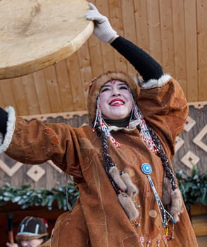 PETROPAVLOVSK, KAMCHATKA, RUSSIA - DECEMBER 24, 2021: Folk ensemble performance in dress of indigenous people of Kamchatka. The holiday Northern aboriginal Koryak
