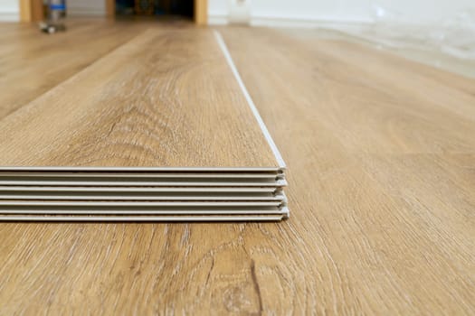 Click vinyl flooring to install yourself in the living room of an apartment
