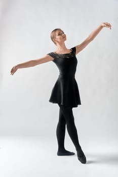 a dancer, on a white background. A dancing woman. The ballerina stands at full height. High quality photo