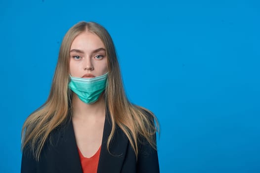 girl with a medical mask on her chin. High quality photo