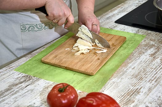 Slicing white cabbage on a cutting Board. High quality photo
