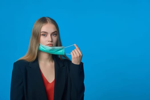 girl with a medical mask on her . High quality photo