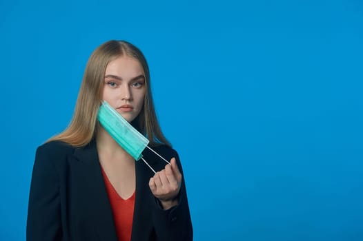 girl with a medical mask on her . High quality photo