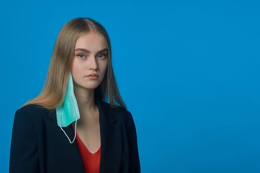 A woman wearing a blue shirt. High quality photo