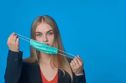 girl with a medical mask on her . High quality photo