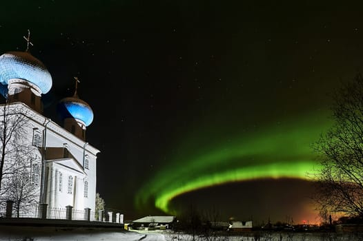 Northern lights on the background of the temple. High quality photo