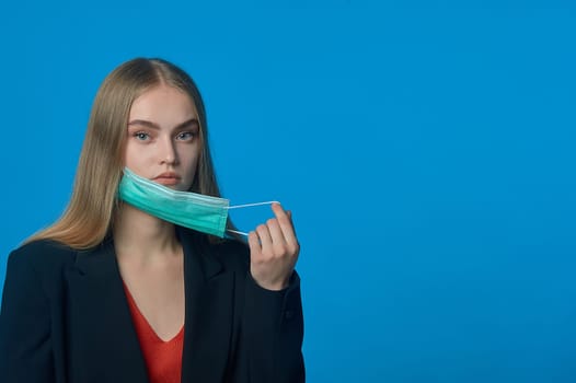 girl with a medical mask on her . High quality photo
