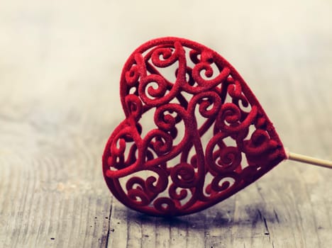 Valentine heart on rustic wooden background