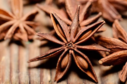 Anise seed on wooden table close up